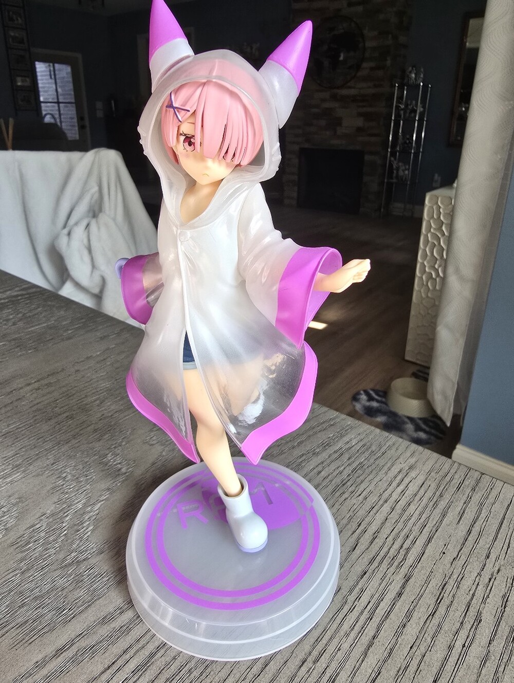 Anime Figure in Clear White & Pink Hooded Raincoat